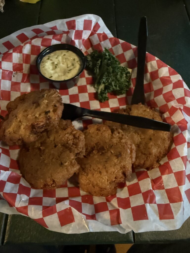 Fried appetizer with dipping sauce at Sandbar Sports Grill