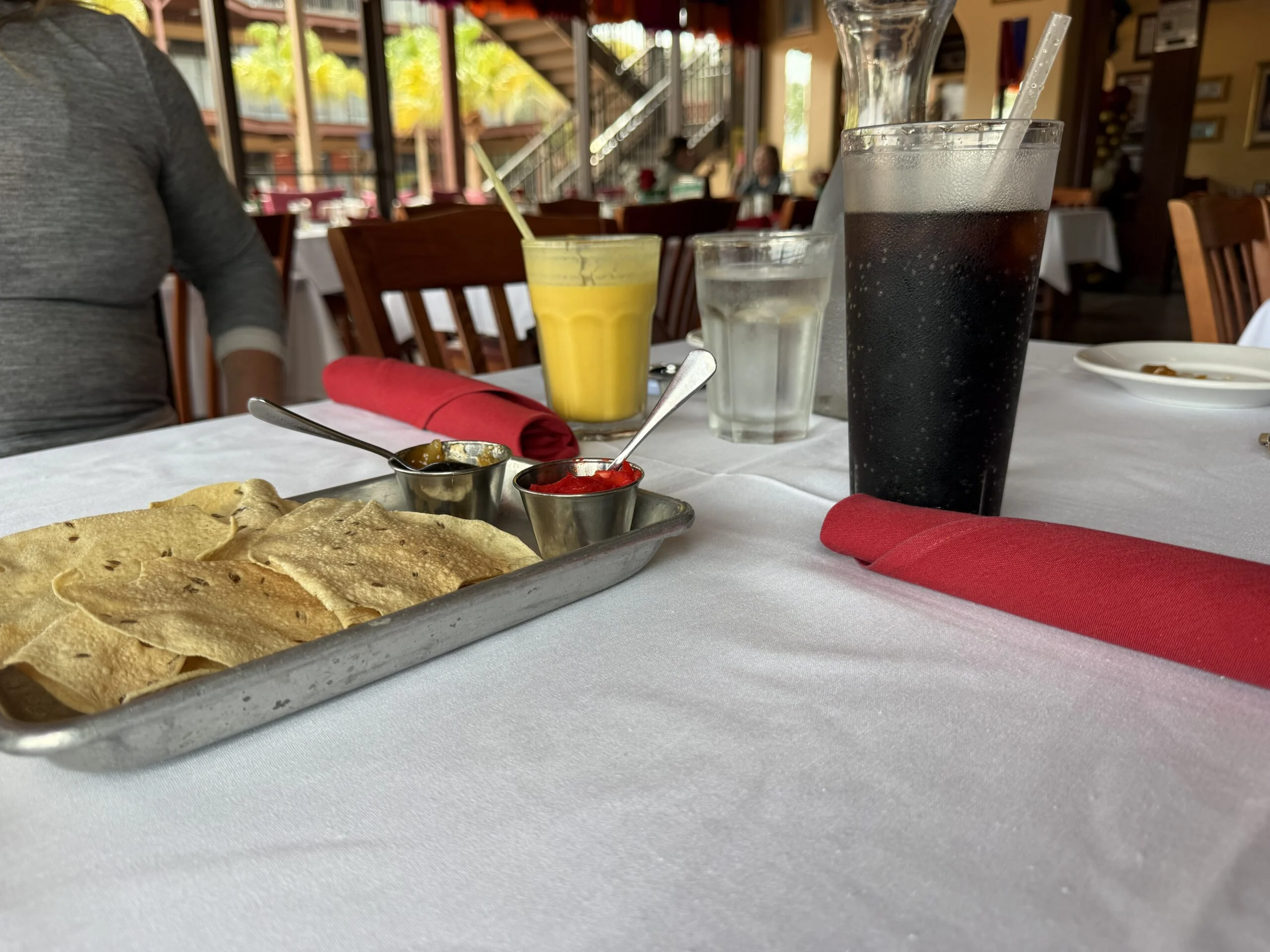 Papadum crackers served with two condiments at Guru’s in Clermont
