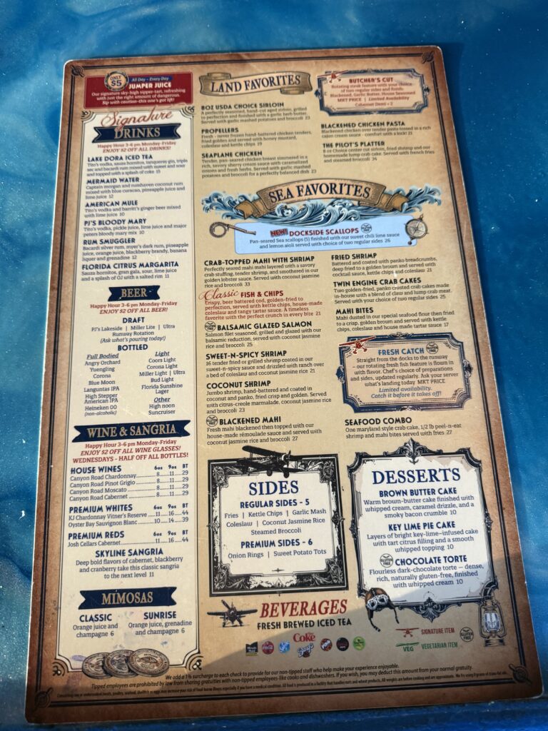Puddle Jumpers menu listing signature drinks, land and sea favorites, beer, wine and desserts